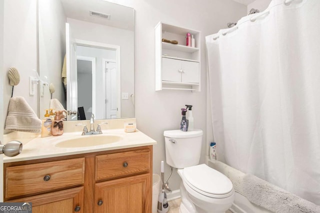 full bathroom featuring vanity, shower / tub combo, and toilet