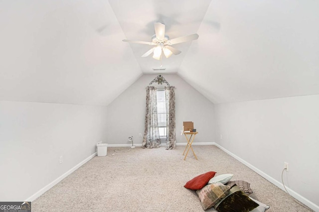 additional living space with ceiling fan, carpet flooring, and lofted ceiling