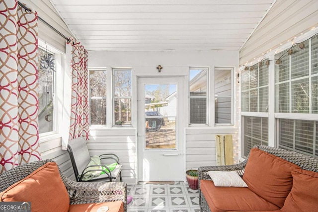 sunroom / solarium with lofted ceiling