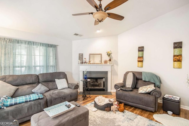 living room with hardwood / wood-style flooring and ceiling fan