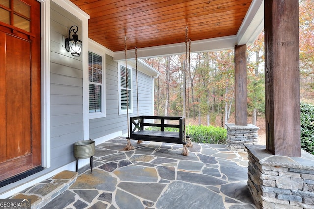 sunroom / solarium with wood ceiling