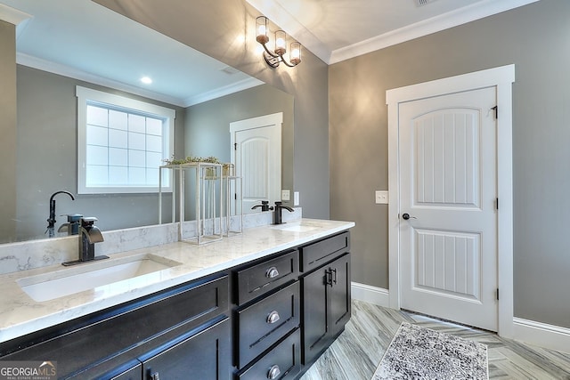 bathroom with ornamental molding and vanity