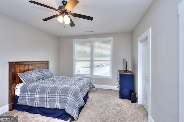 bedroom with light colored carpet and ceiling fan