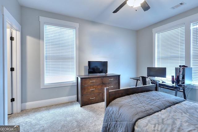 bedroom featuring ceiling fan and light colored carpet