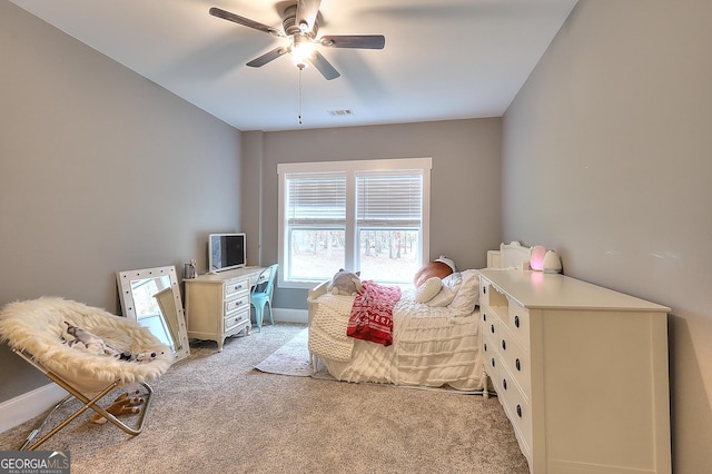 bedroom featuring ceiling fan and light colored carpet