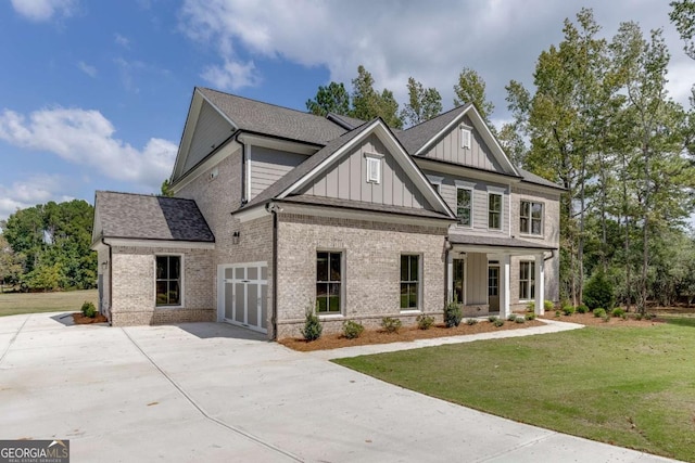 craftsman-style home featuring a front yard and a garage