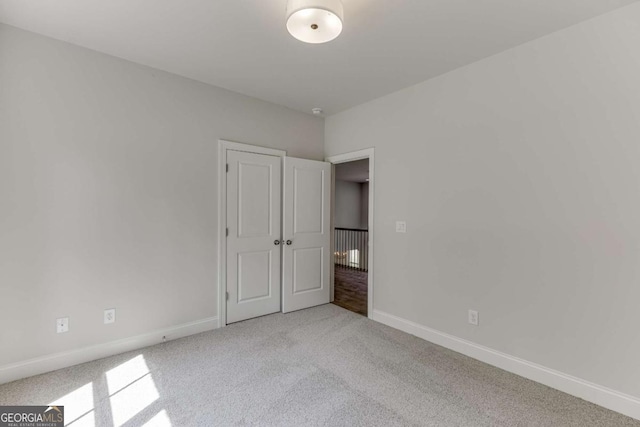 unfurnished bedroom with light carpet