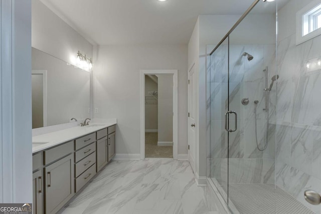 bathroom with vanity and a shower with door