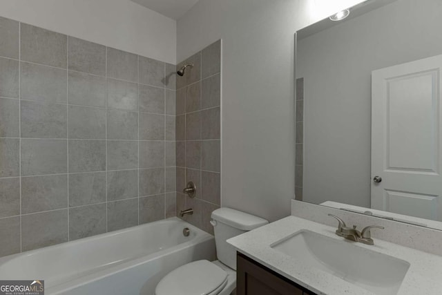 full bathroom with tiled shower / bath combo, vanity, and toilet