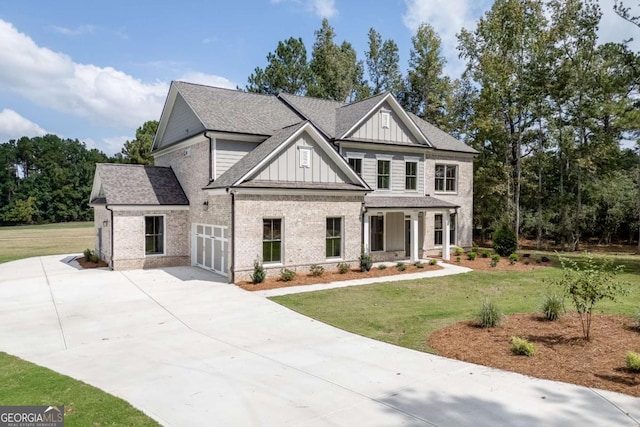 view of front of property with a front lawn, a porch, and a garage