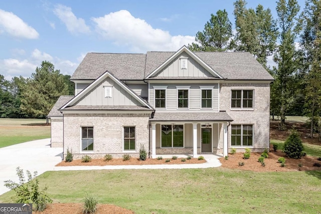 craftsman-style home with a front yard