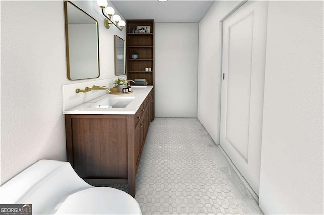 bathroom with toilet and vanity