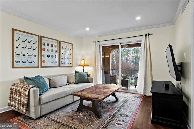 living room featuring dark hardwood / wood-style flooring and crown molding