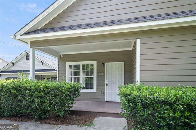 property entrance with covered porch