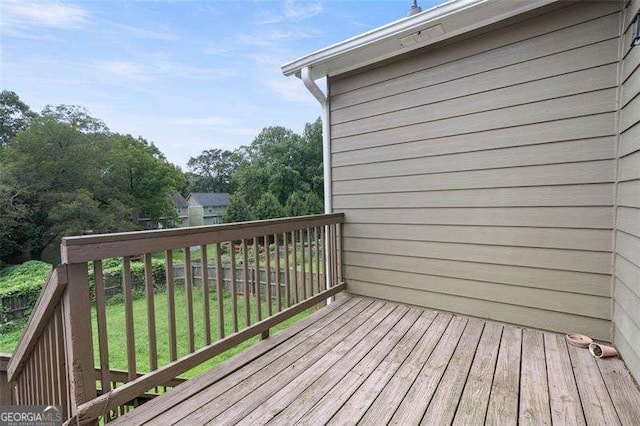 deck featuring a lawn