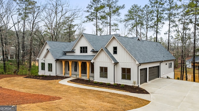 modern farmhouse featuring covered porch and a garage