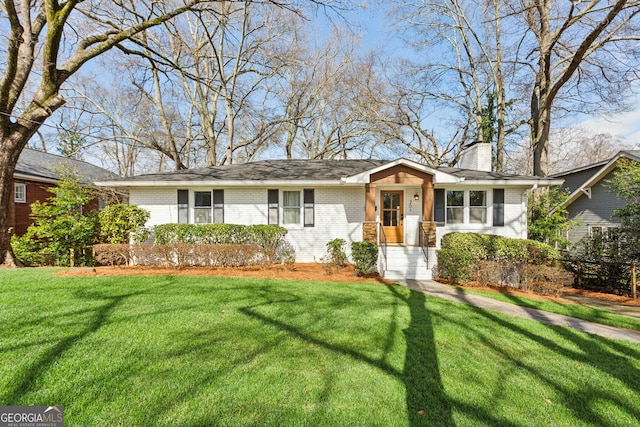 ranch-style home featuring a front yard