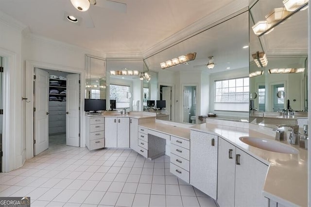 bathroom featuring crown molding, ceiling fan, tile patterned flooring, and vanity