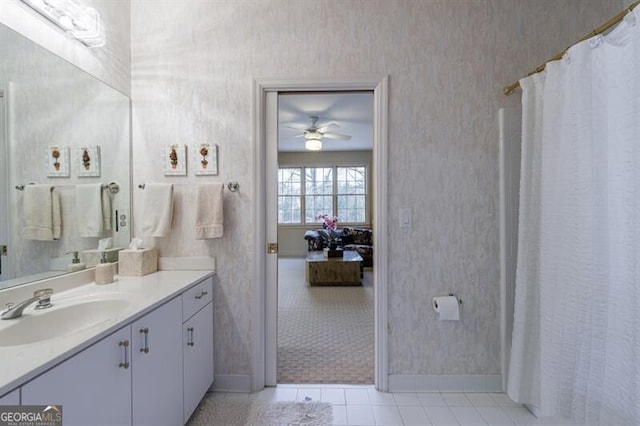 bathroom featuring ceiling fan, vanity, and tile patterned flooring