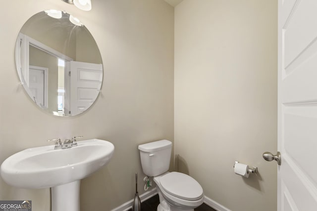 bathroom featuring sink and toilet