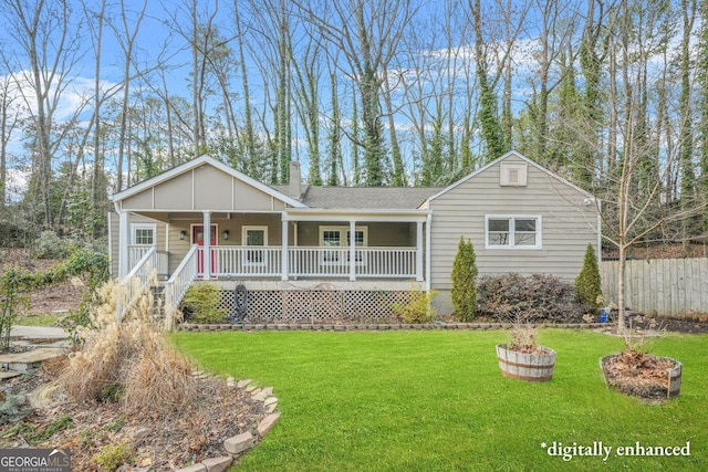 ranch-style home featuring a front lawn and a porch