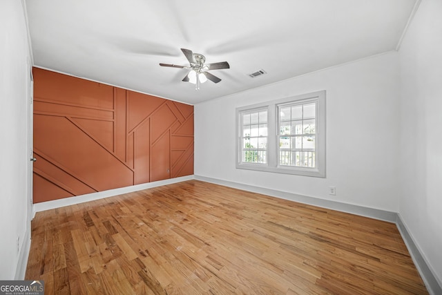 unfurnished room with ceiling fan and light hardwood / wood-style flooring