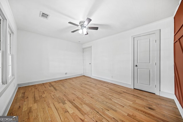 unfurnished bedroom featuring ornamental molding, ceiling fan, and light hardwood / wood-style floors