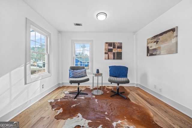 sitting room featuring hardwood / wood-style floors