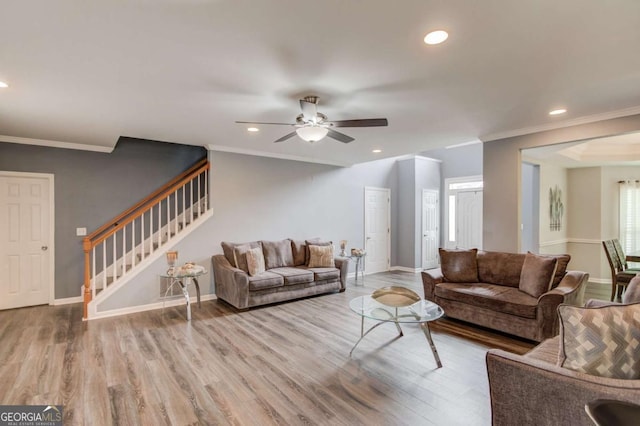 living room featuring recessed lighting, stairs, baseboards, and wood finished floors