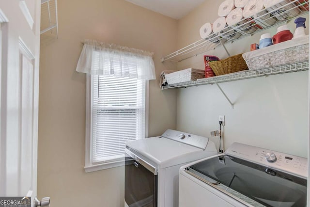 washroom featuring washer and dryer and laundry area