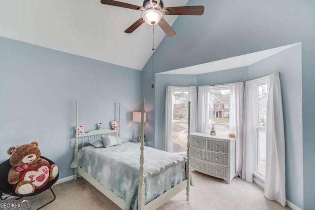 bedroom with high vaulted ceiling, light colored carpet, baseboards, and ceiling fan