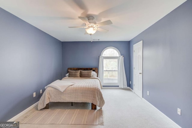 bedroom with carpet flooring, baseboards, and ceiling fan