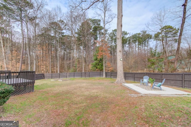 view of yard featuring a deck and a fenced backyard