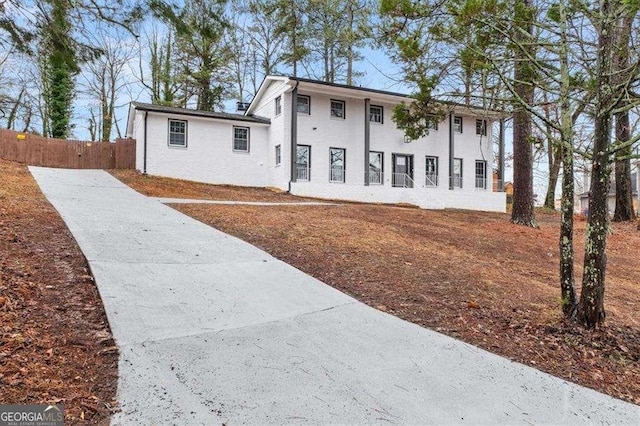 view of front of house featuring fence