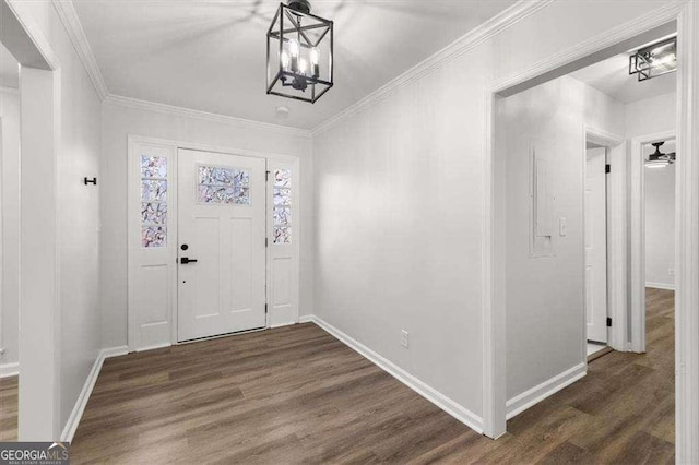 entrance foyer with baseboards, crown molding, and dark wood-type flooring