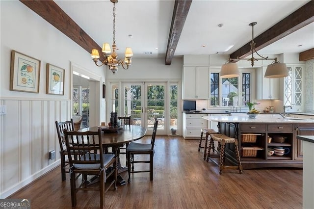 dining space featuring french doors, dark hardwood / wood-style floors, and beam ceiling