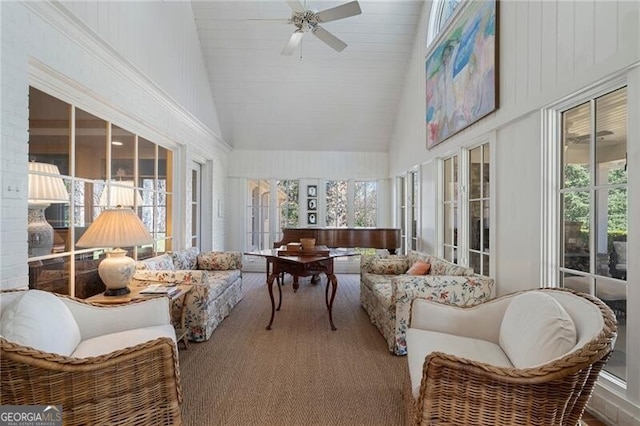 sunroom featuring vaulted ceiling and ceiling fan