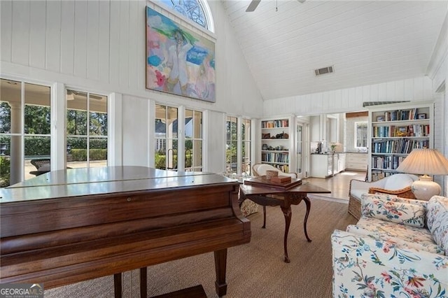 sunroom / solarium featuring vaulted ceiling and ceiling fan