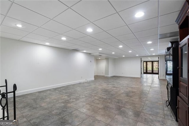 basement featuring a paneled ceiling