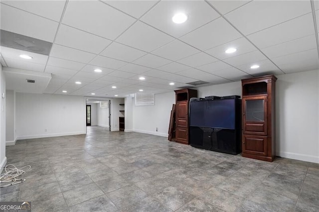 unfurnished living room featuring a paneled ceiling