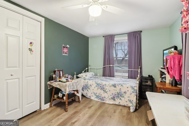 bedroom featuring ceiling fan and light hardwood / wood-style floors