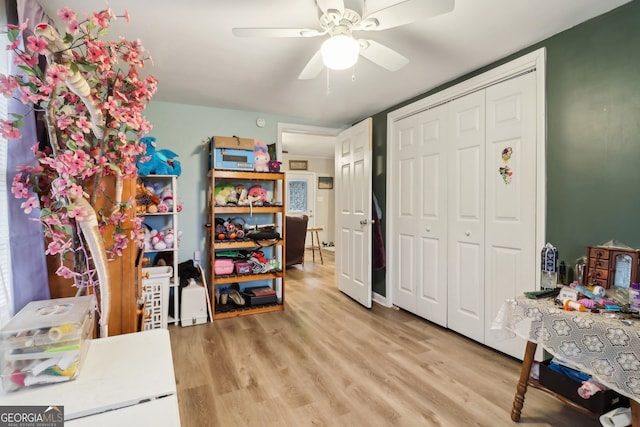 interior space with ceiling fan and light wood-type flooring