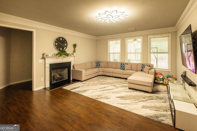 living room with dark wood-type flooring and crown molding