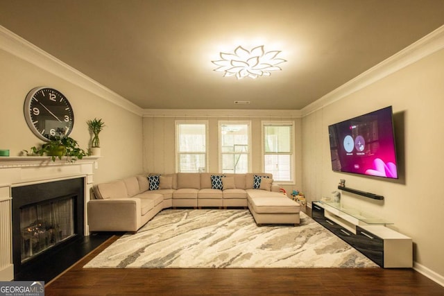 living room featuring dark wood-type flooring and ornamental molding