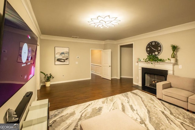 living room with dark hardwood / wood-style floors and ornamental molding