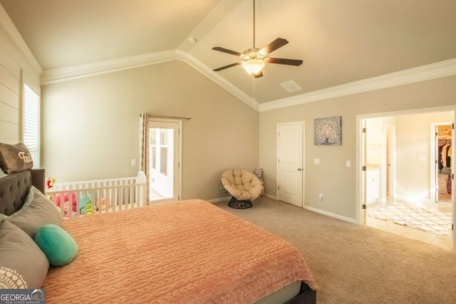 carpeted bedroom with ceiling fan, vaulted ceiling, and crown molding