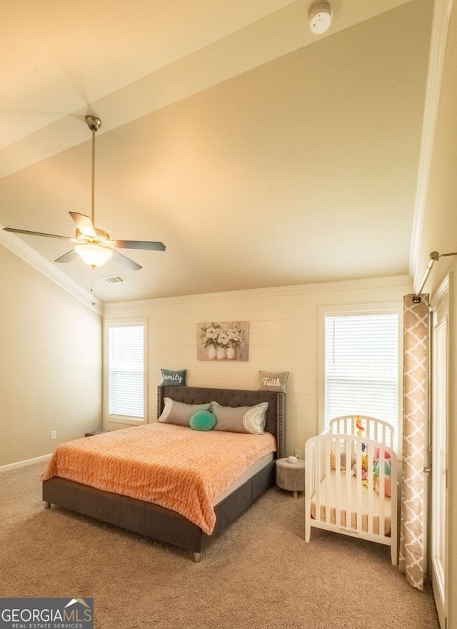 carpeted bedroom with crown molding and ceiling fan