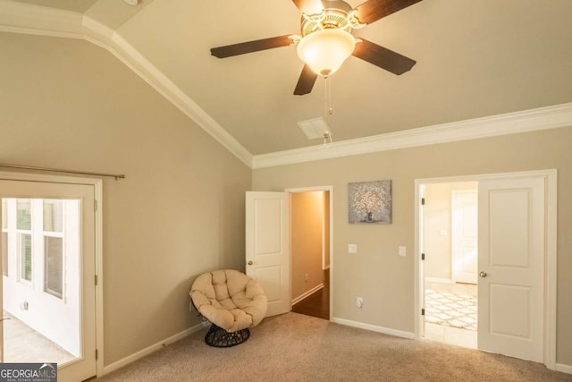 unfurnished room featuring ceiling fan, ornamental molding, light colored carpet, and lofted ceiling