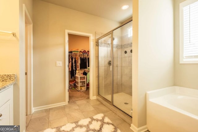 bathroom with plus walk in shower and vanity