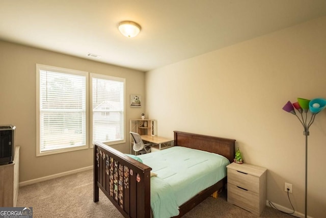 bedroom with light carpet